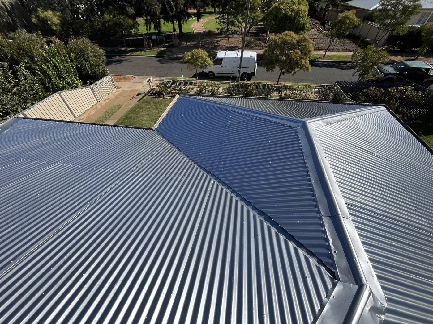Newly coated corrugated metal roof in monument grey