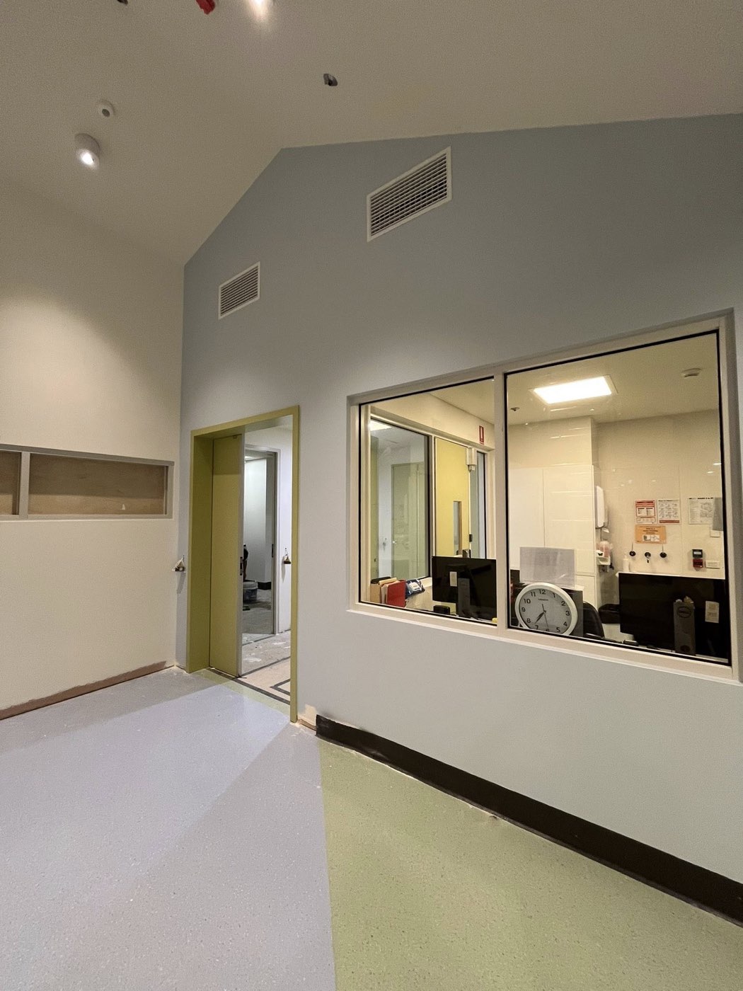 Commercial interior with green feature doorways