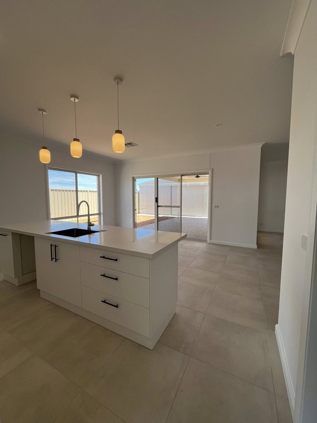 Kitchen island with three pendant lights